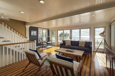 a living room with a couch and a table at Pine Creek Beach House in Fairfield