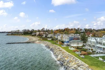 an aerial view of a town with houses and the water at Pine Creek Beach House in Fairfield