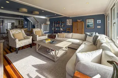 a living room with a couch and a table at Pine Creek Beach House in Fairfield