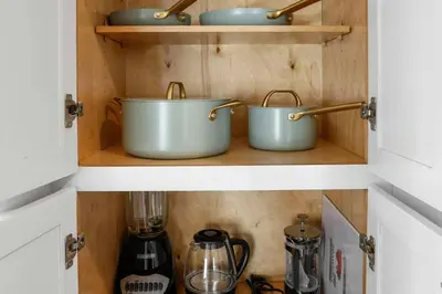 two pots on a shelf in a kitchen at Harbor Haven, Apt #2, 2 BR/1BA in Stamford