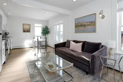 a living room with a couch and a table at Harbor Haven, Apt # 3, 3BR/2BA in Stamford