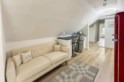 a living room with a couch and a kitchen at Harbor Haven, Apt #4 - 2BR/1BA in Stamford
