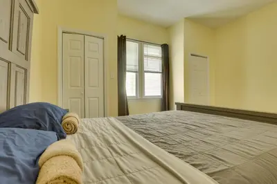 a bedroom with a large bed and a window at Easy NYC Access Updated Apt Near Parks and Bay! in Mount Vernon