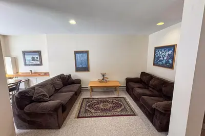a living room with a couch and a table at Glen Run 2S in West Dover
