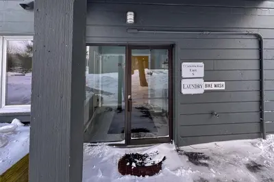a door of a building with snow on the ground at Glen Run 2S in West Dover