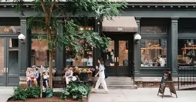 a group of people walking in front of a store at Fully renovated 3 BDR Apt East Village in New York