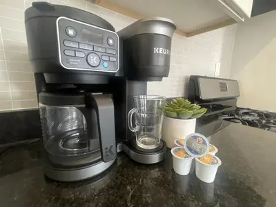 a coffee maker sitting on top of a counter at Perfect for Extended Stay 1B1B Apt 15 Mins to NYC in Jersey City