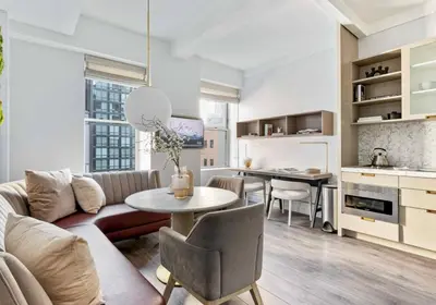 a living room with a couch and a table at Alluring and Spacious 1 Bed 1 Bath Apt in New York