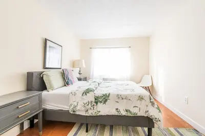 a bedroom with a bed and a window at Stunning 3 Bed Fully Furnished Apt in New York