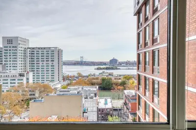 a view of a city from a window at Blueground East Harlem pool nr Central Park NYC-687 in New York