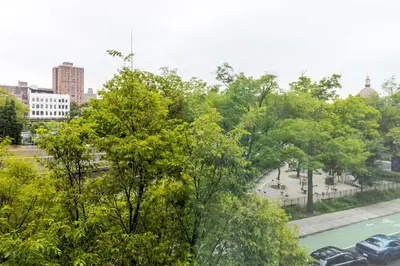 a view of a city with trees and a street at Blueground South Williamsburg washer nr Domino Park NYC-1866 in Brooklyn