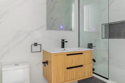a bathroom with a sink and a shower and a toilet at Blueground South Williamsburg washer nr Domino Park NYC-1866 in Brooklyn
