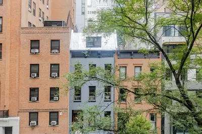 a group of tall buildings in a city at Blueground Murray Hill washer nr Bryant Park NYC-1870 in New York