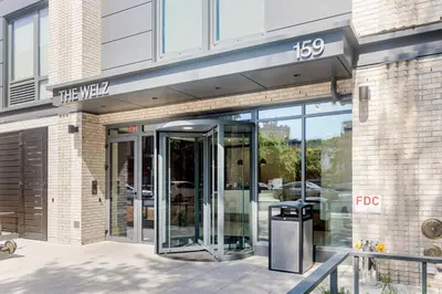 an entrance to a building with a revolving door at Blueground Southside rooftop nr McCarren Park NYC-2012 in Brooklyn
