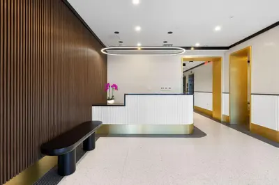 a corridor with a bench in a lobby at Blueground Southside rooftop nr McCarren Park NYC-2012 in Brooklyn
