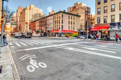 an empty street in a city with buildings at Blueground Yorkville pool nr Central Park NYC-2218 in New York
