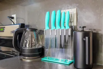 a counter with a blender with tooth brushes in it at Suite 24 - East Harlem, Manhattan by Monthier in New York