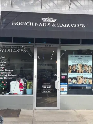 a store front of a french kills and hair club at Serene Haven of Tranquility in Maplewood