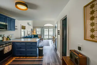 a kitchen with blue cabinets and a counter top at Lakefront Escape with Dock! Hudson Valley Home in Hillsdale