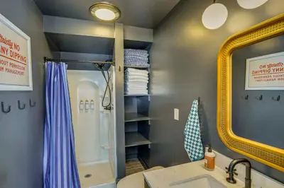 a bathroom with a shower and a sink and a mirror at Lakefront Escape with Dock! Hudson Valley Home in Hillsdale