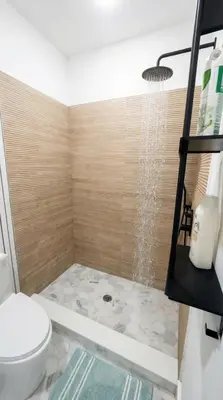 a bathroom with a shower with a toilet at Furnished Private room with shared spaces in Jersey City