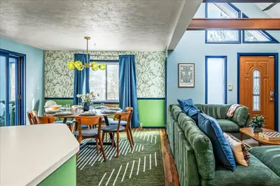 a living room with a couch and a table at Movie Theater Game Room Resort Amenity Access in Tobyhanna