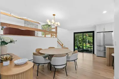 a kitchen and dining room with a table and chairs at Renovated Retreat with Heated Pool in Redding