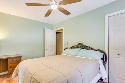 a bedroom with a bed with a ceiling fan at Pet Friendly and WFH Ready! Quiet Hudson Valley Apt in Newburgh