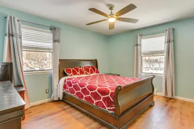 a bedroom with a bed and a ceiling fan at Pet Friendly and WFH Ready! Quiet Hudson Valley Apt in Newburgh
