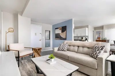 a living room with a couch and a table at Landing Stylish 1BD Gym in New Haven