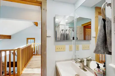 a bathroom with a sink and a mirror at Mountain View Memories at Northridge in Tannersville
