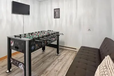 a foosball table in a room with a couch at Mountain View Memories at Northridge in Tannersville