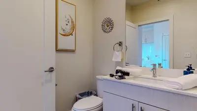 a bathroom with a sink and a toilet and a mirror at Stylish Home With Free ParkingFA in Stamford