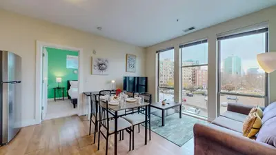 a living room with a table and a couch at Stylish Home With Free ParkingFA in Stamford
