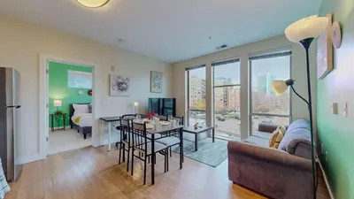 a living room with a couch and a table at Stylish Home With Free ParkingFA in Stamford