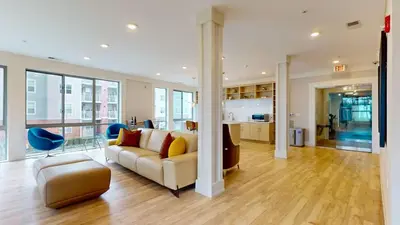 a living room with a couch and a table at Stylish Home With Free ParkingFA in Stamford