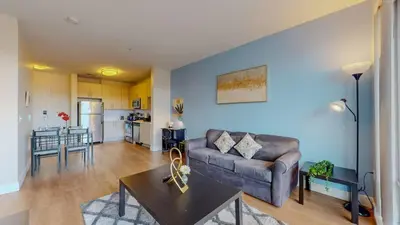 a living room with a couch and a table at Stylish Home With Free ParkingZA in Stamford