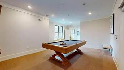 a billiard table in a room with a wall at Stylish Home with Free Parking in Stamford