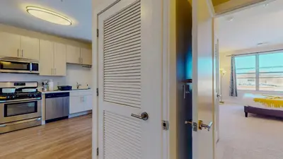 a kitchen with a door leading to a bedroom at Comfort Meets Convenience Parking Gym near NYC in Stamford