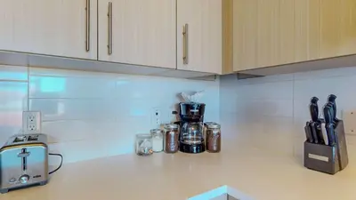 a kitchen counter with a coffee maker on a counter top at Comfort Meets Convenience Parking Gym near NYC in Stamford
