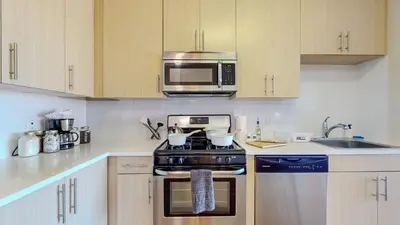 a kitchen with a stove and a microwave at Great Charming stay in Stamford