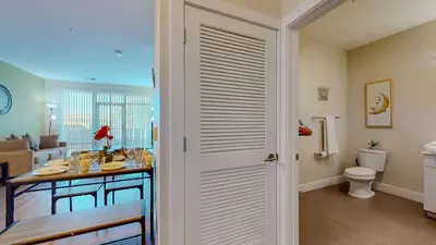 a kitchen with a table and a toilet in a room at Elegant Home in Stamford