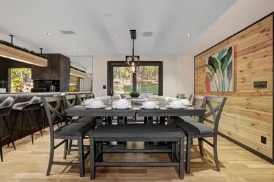 a dining room with a table and chairs at The Luxe Lodge Escape in Tannersville