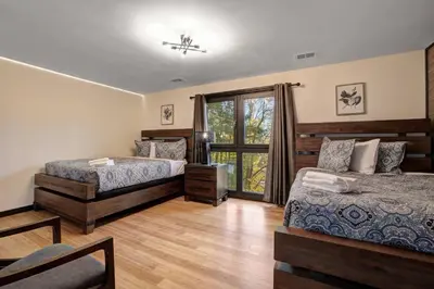 a bedroom with two beds and a window at The Luxe Lodge Escape in Tannersville