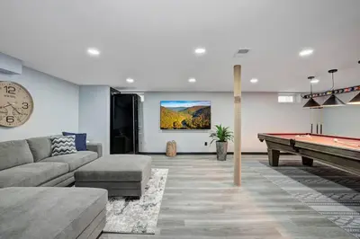 a living room with a pool table in it at The Luxe Lodge Escape in Tannersville