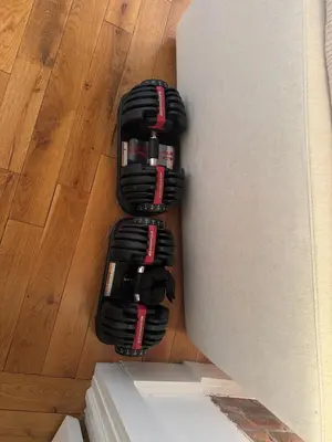 a pile of black cords on the floor next to a wall at Sky-High Sanctuary Penthouse with Panoramic Views in Brooklyn