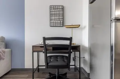 a black chair at a desk in a room at Landing Chic 1BD Pool Game Room in Hartford