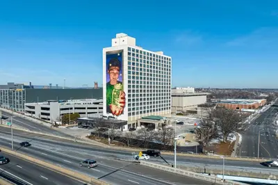 a building with a large mural on the side of it at Landing Chic 1BD Pool Game Room in Hartford