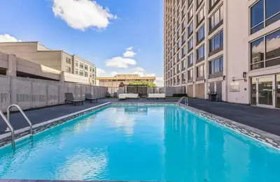 a swimming pool in the middle of a building at Landing Chic 1BD Pool Game Room in Hartford