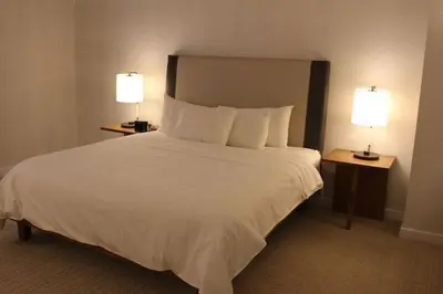 a hotel room with a large bed with two lamps at Club Wyndham Midtown 45 in New York